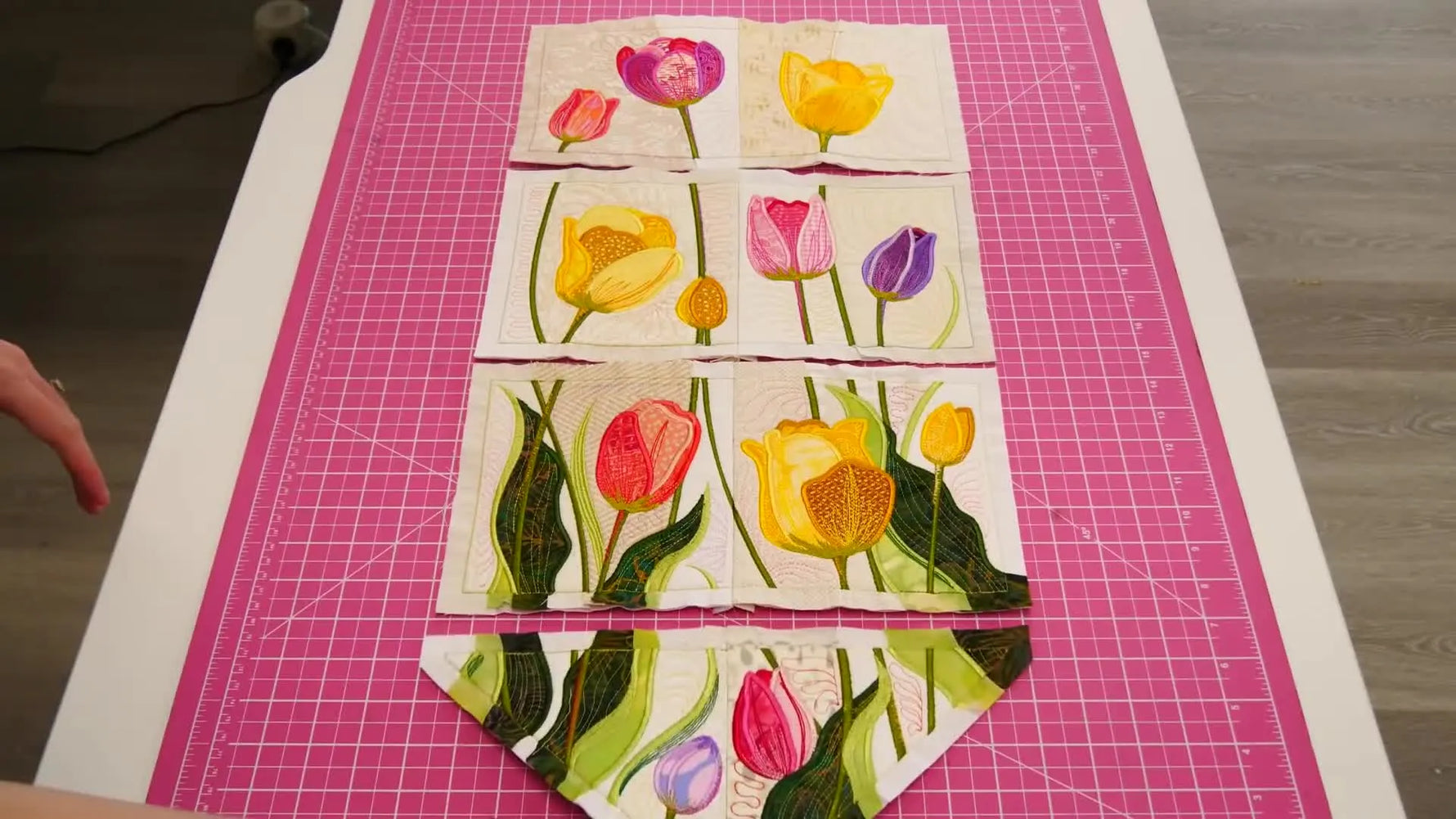 An overhead layout of the joined Tulip Fields Hanger blocks arranged in neat vertical rows on a cutting table before final finishing.