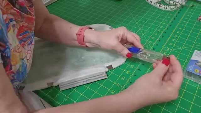 An overhead view of a Durkee Sticky Hoop with No-Show Mesh stabilizer neatly folded and secured all around the metal frame using multiple Supa Clips.