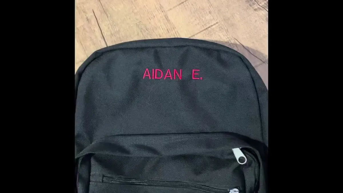 Intro slide showing a black backpack with 'AIDAN E.' embroidered in red.