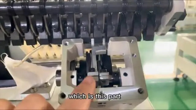 A close-up of the cam mechanism shows the black roller perfectly centered in the cam fork—your visual proof the color change timing is back in sync.