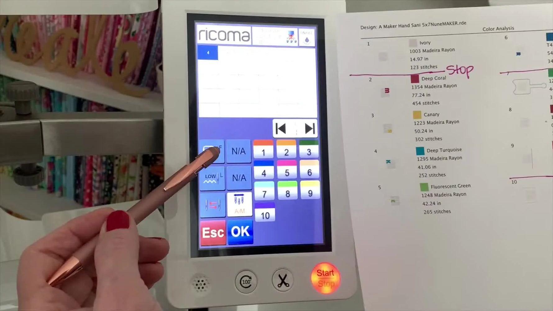 A close-up of the Ricoma touchscreen showing the “Frame Out” (F icon) enabled so the hoop advances for in-the-hoop placement steps.