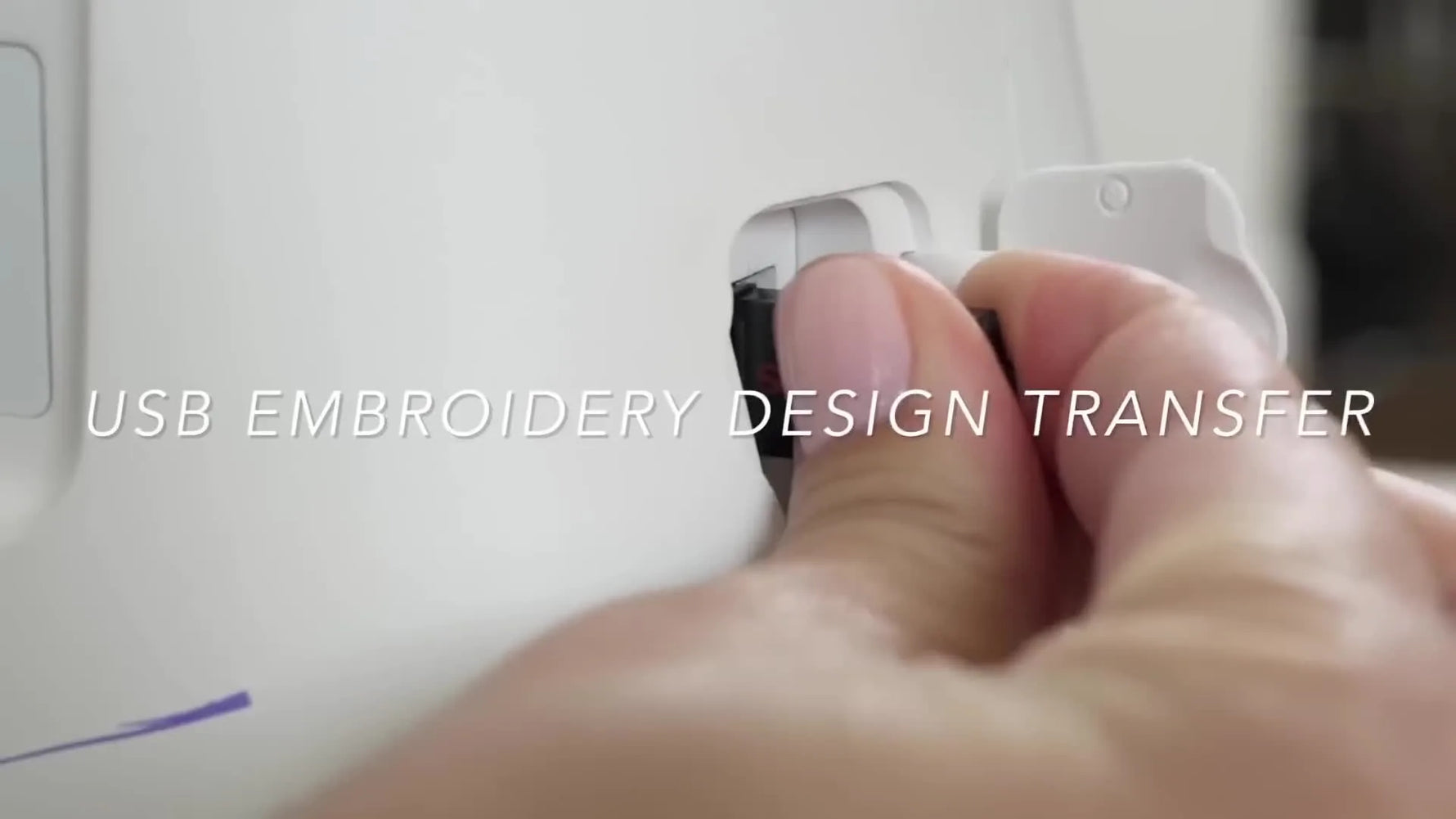 A large embroidery hoop is being attached to a Singer Legacy SE300 embroidery unit, showing the locking mount and setup position.