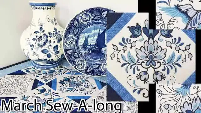 The finished Delft table runner styled on a table with blue-and-white ceramics, showing the crisp blocks, padded borders, and clean binding.