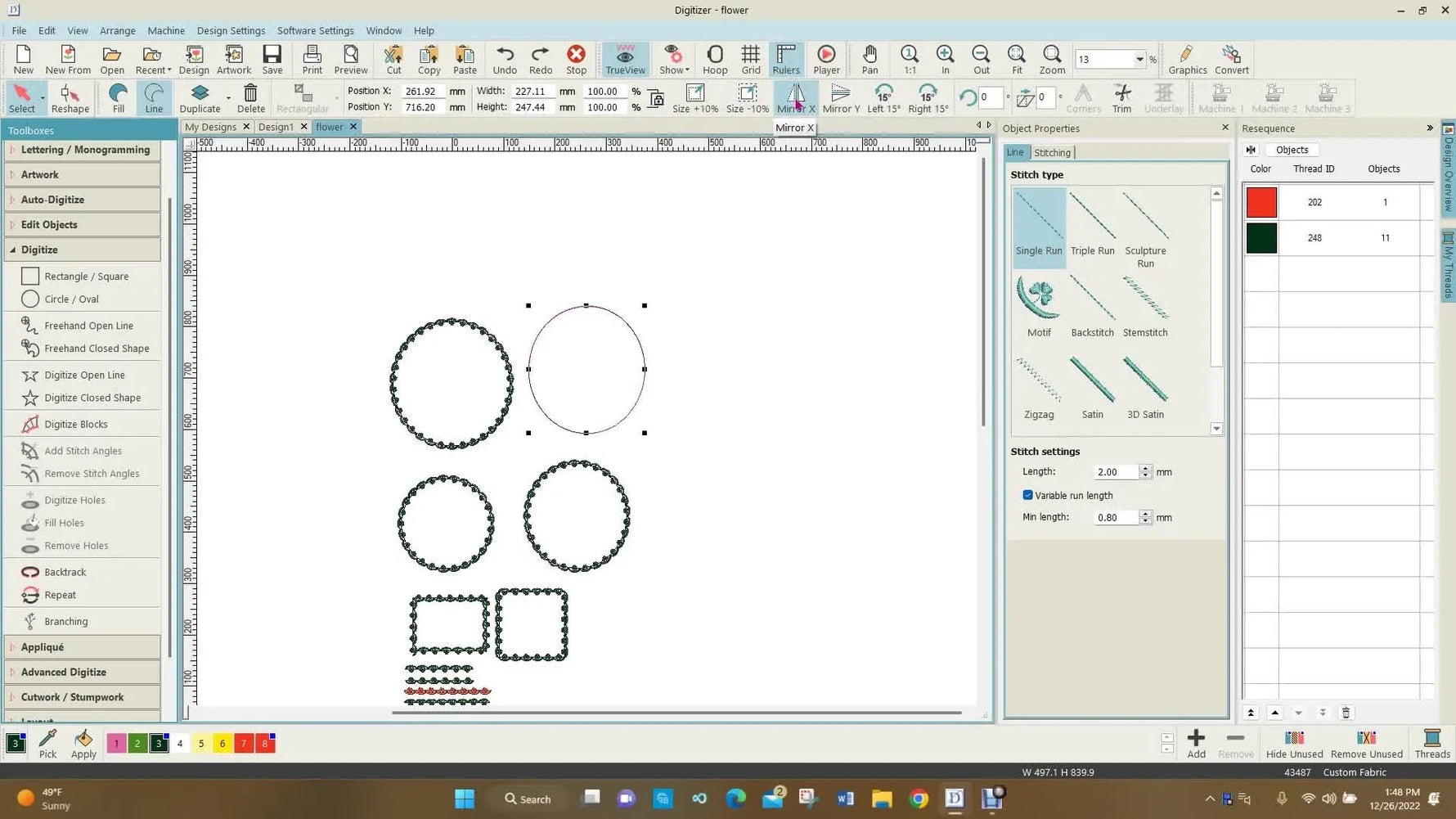 A screen capture shows the cursor clicking the Vertical Mirror Image icon—the key move that flips a circular motif outward in Digitizer MBX.