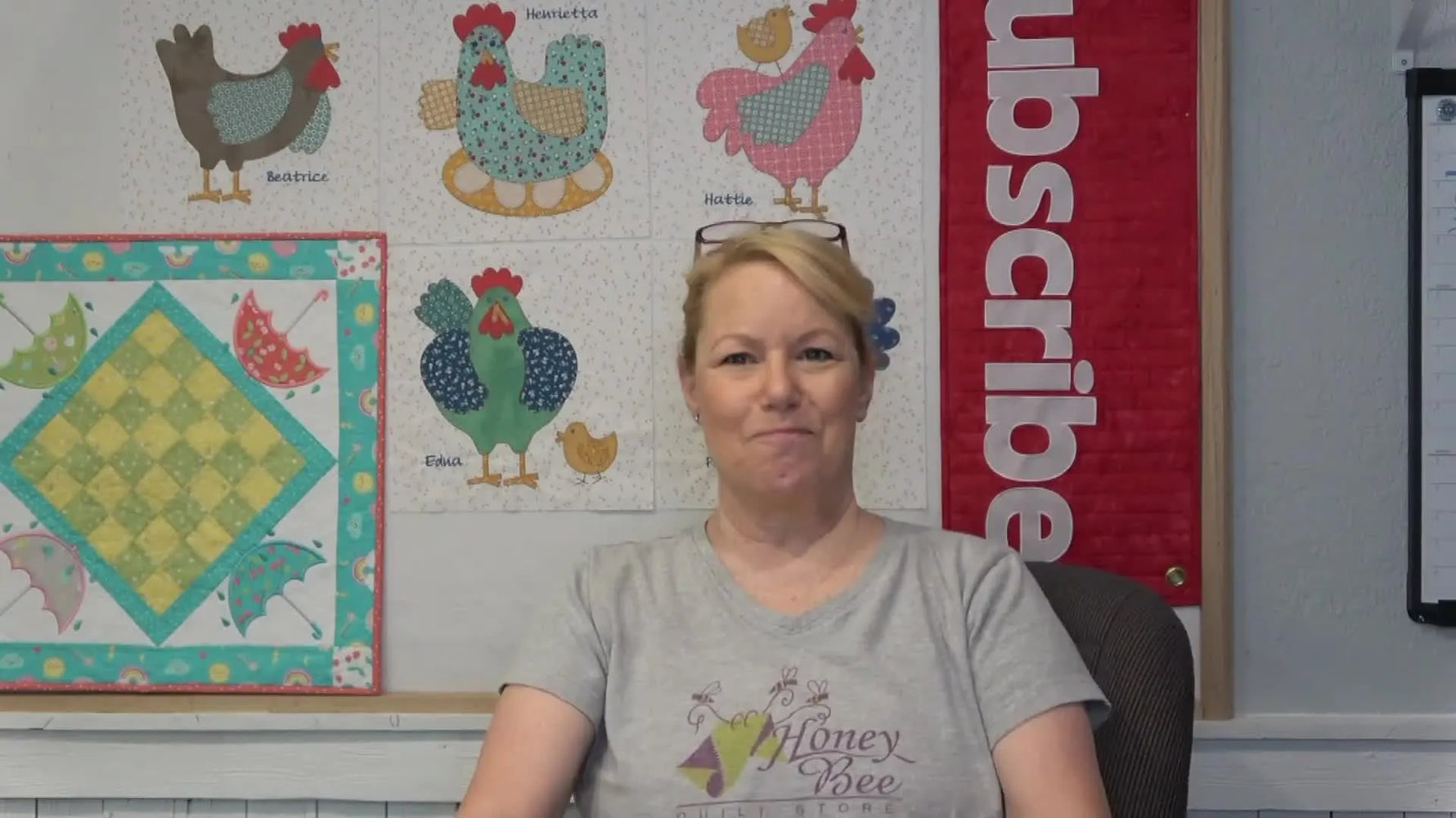 Becky holds up the Moda “Hey Y’all” quilt kit box during the unboxing segment.