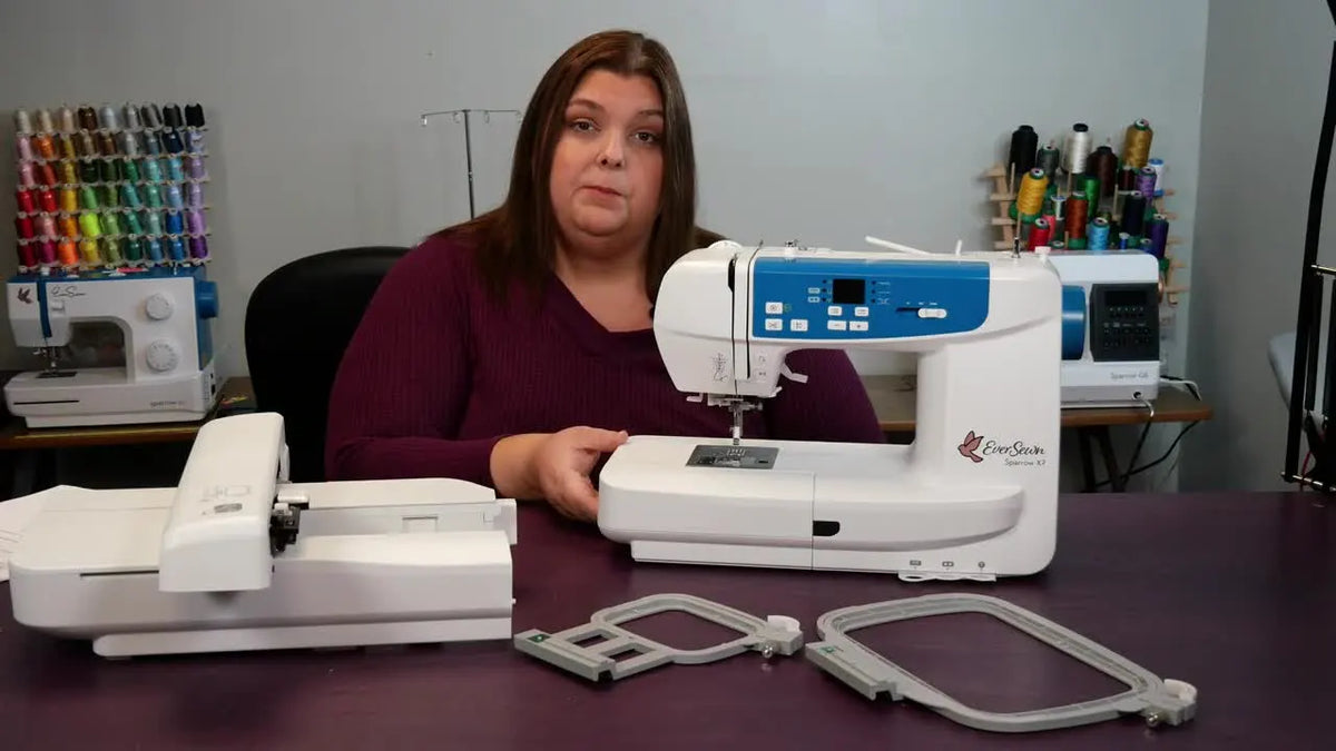 Woman demonstrating the EverSewn Sparrow X2 sewing machine and embroidery unit.