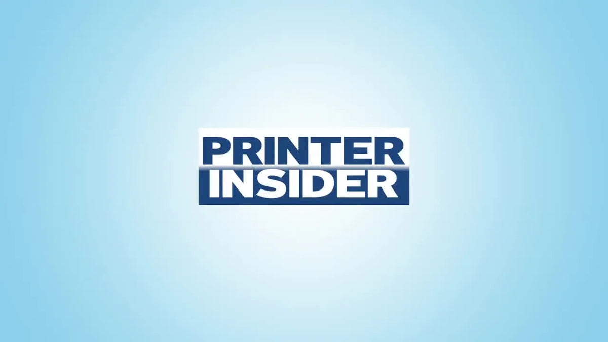 Brother DCP-L2640DW printer next to a laptop