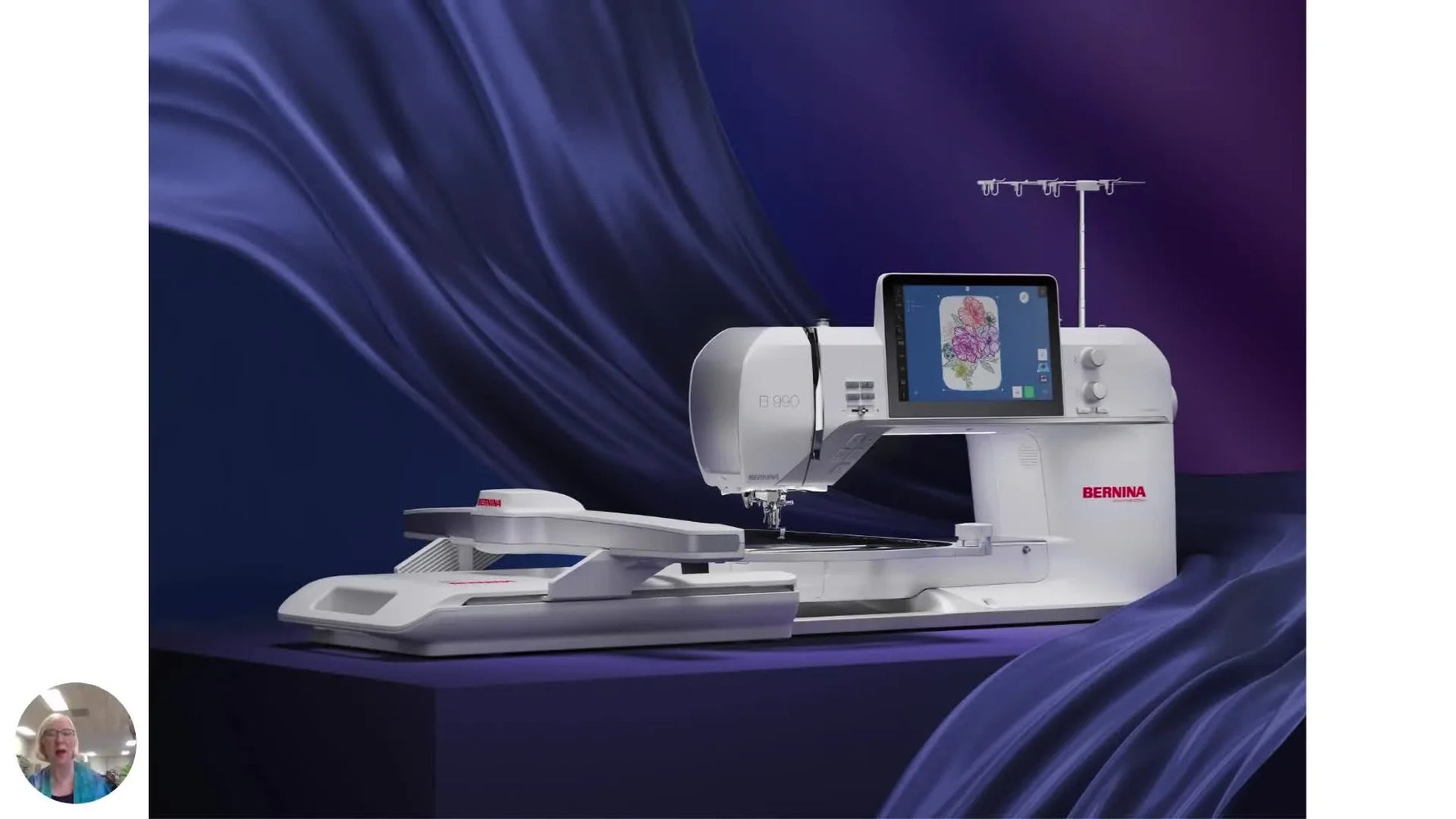 A wide view of the Bernina 990 with the embroidery module attached and the large central touchscreen lit up.