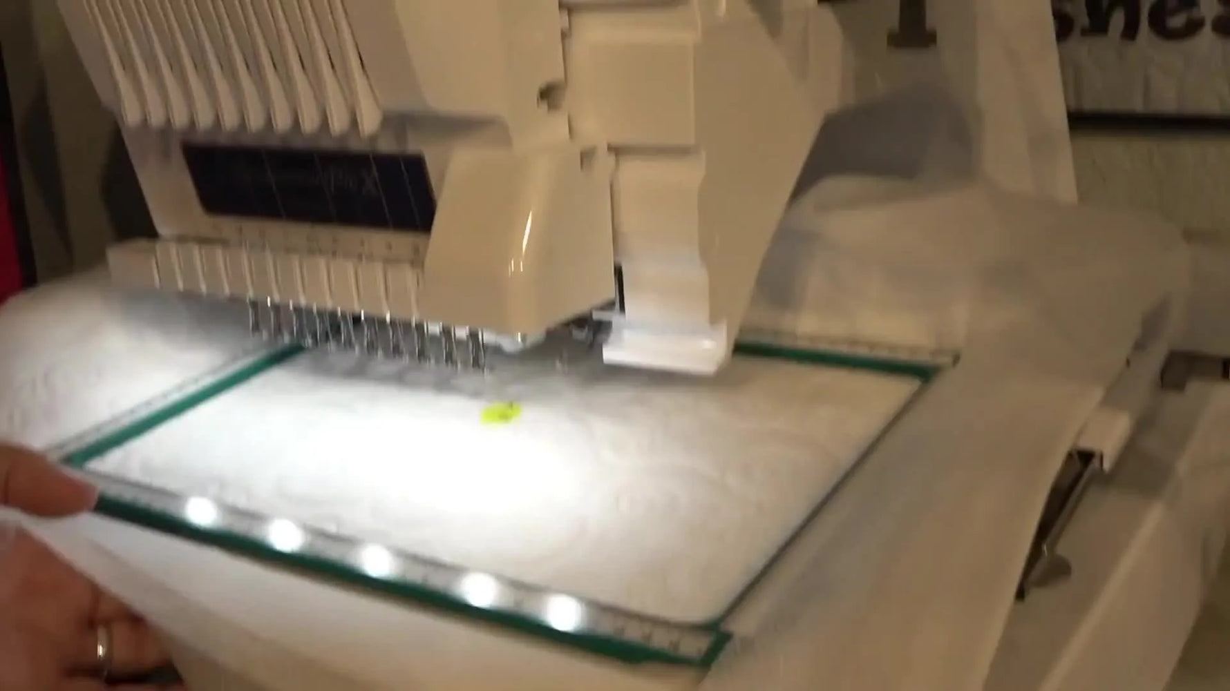 A thick quilted pocket panel is floated in a large hoop and held firmly with yellow SewTites Magnum magnets for safe, accurate multi-needle embroidery.