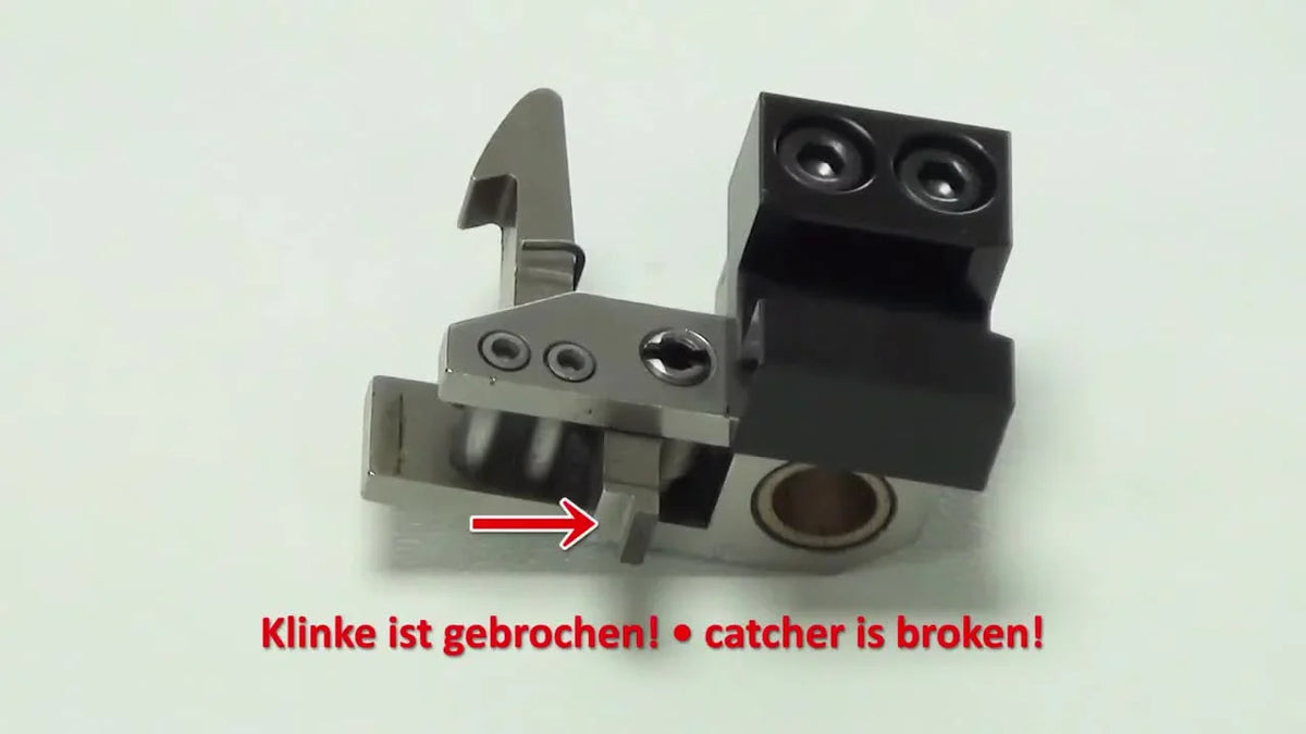 Broken catcher mechanism close-up