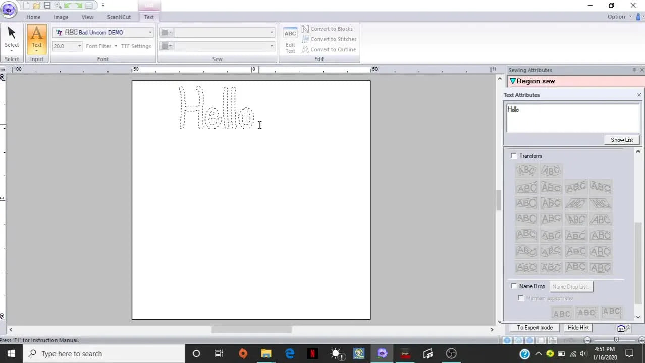The word “Hello” appears on the PE-Design 10 canvas after being entered through the Text Attributes panel, showing the baseline result before resizing and transforms.
