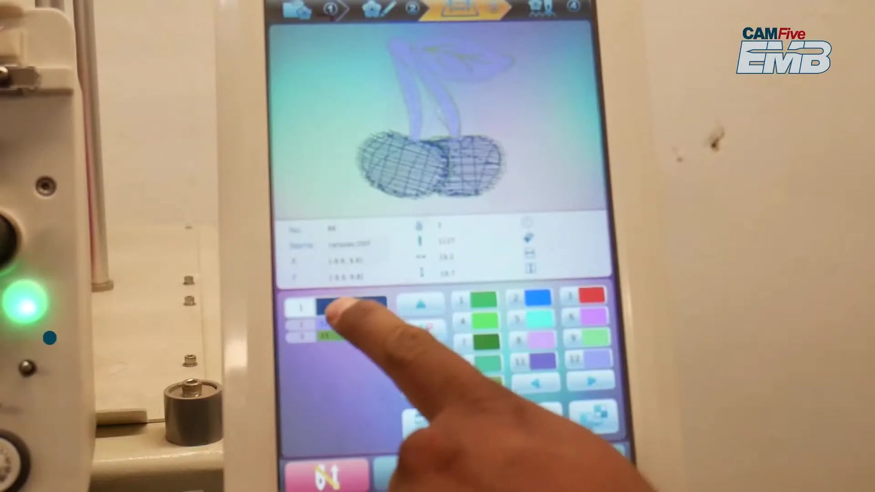 The CAMFive A15 Tab 4 screen shows a centered design preview with the yellow hoop-selection icon ready to be tapped.