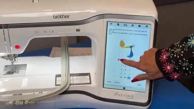 The Stellaire 2 screen shows an embroidery design rotating automatically after two laser alignment points are set.