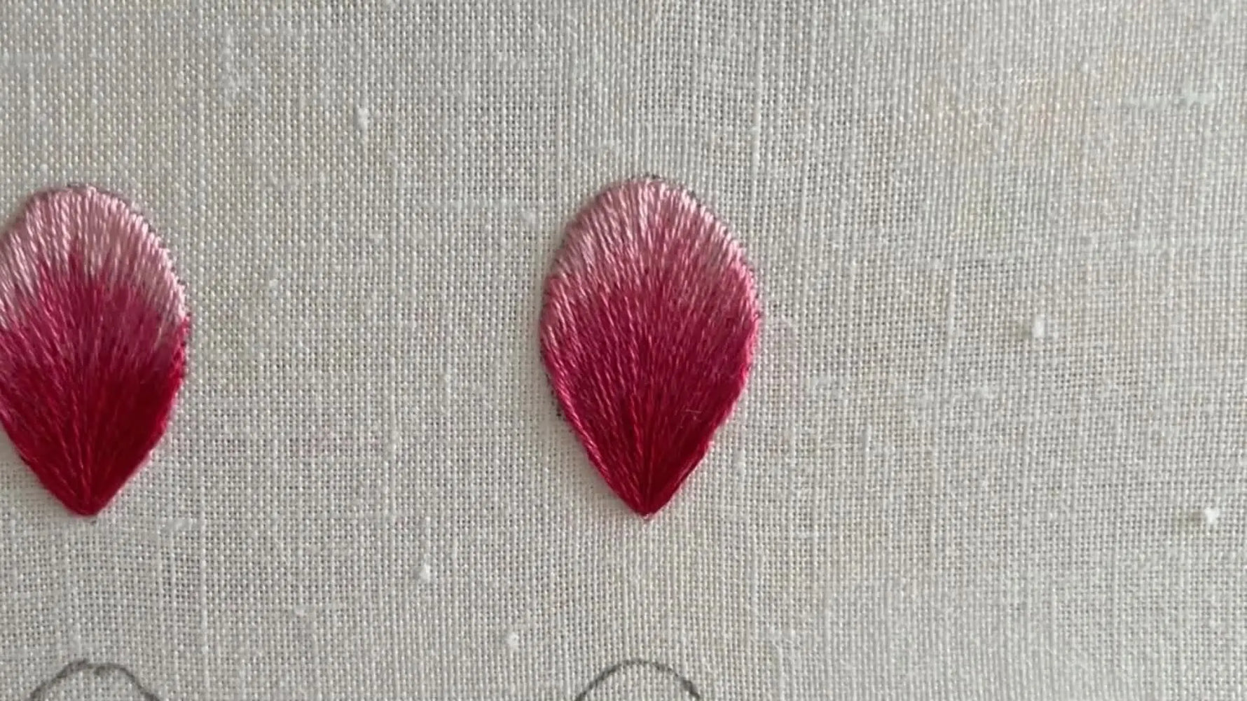 The finished embroidered petal with a perfect five-color gradient, shown next to an empty petal outline for comparison.