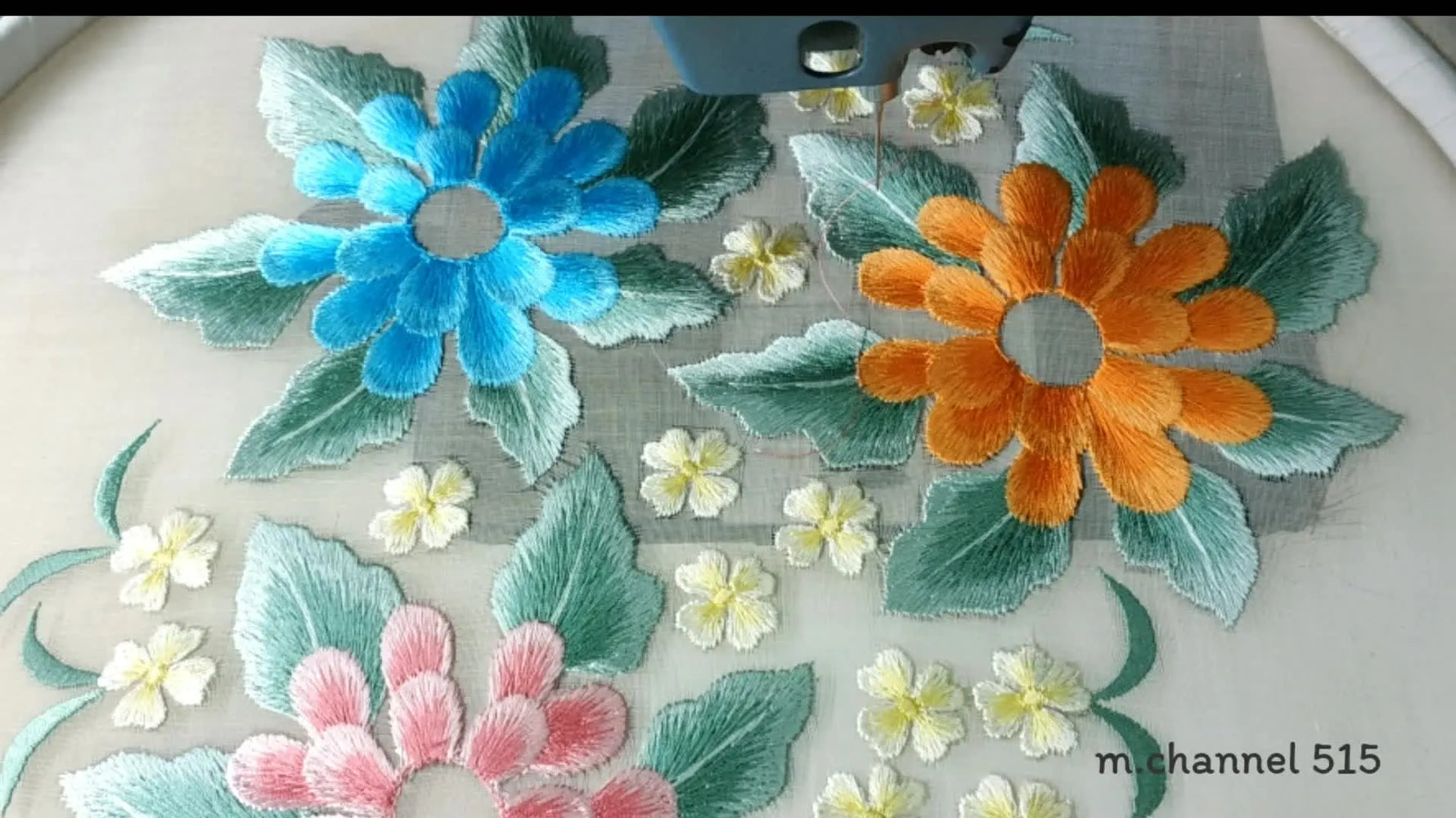 Finished cutwork flower embroidery on fabric.