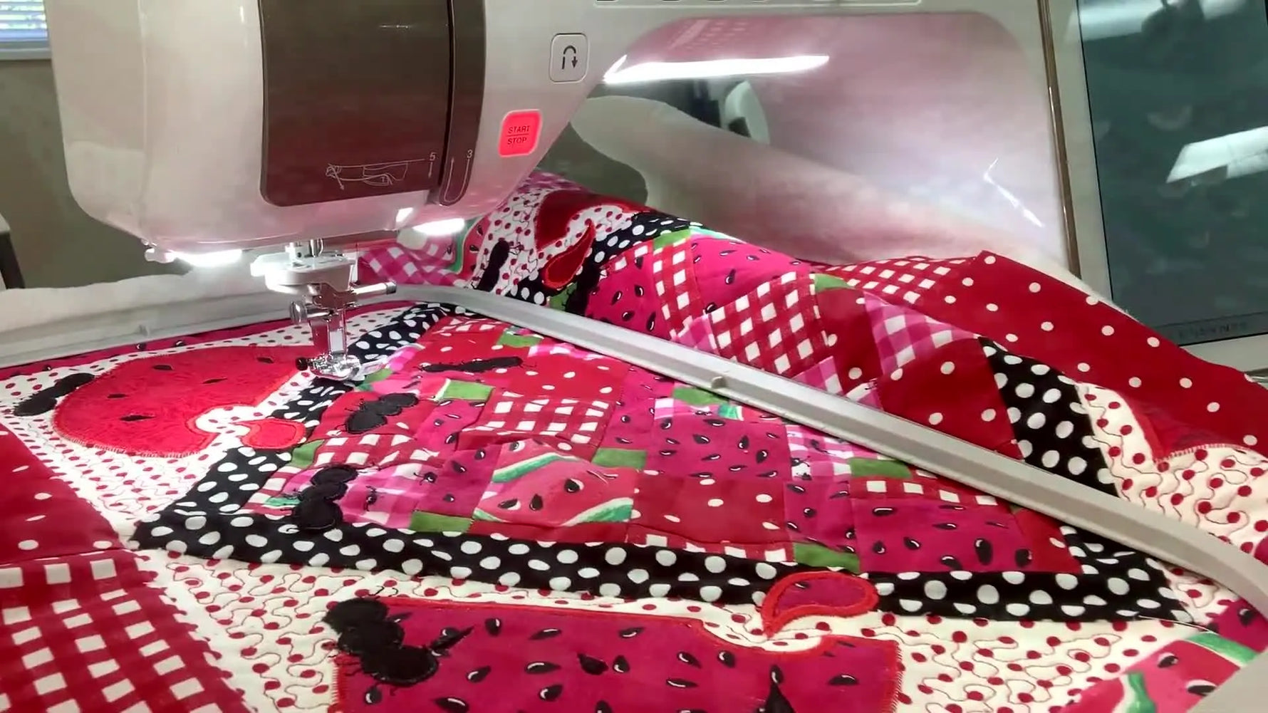 A full flat-lay view of the finished Kimberbell “Watermelon Cuties” table topper showing all blocks and the completed quilting and appliqué details.