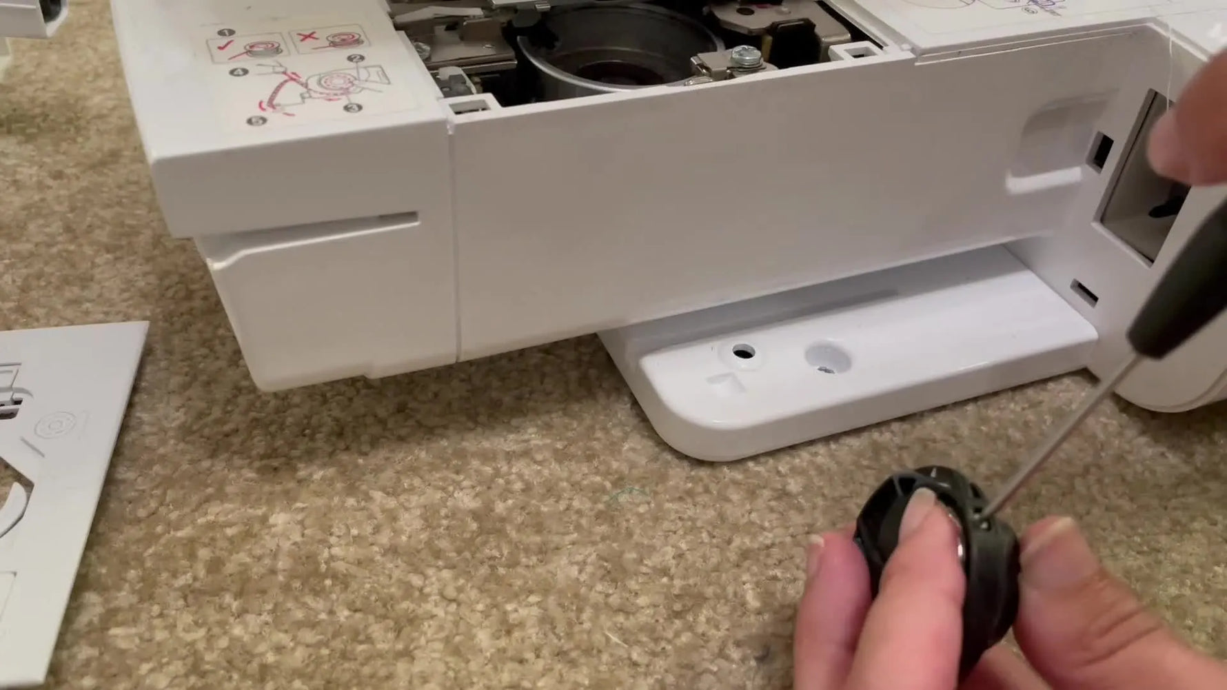 An extreme close-up shows a small flathead screwdriver adjusting the bobbin case tension screw on a Brother PE550D.