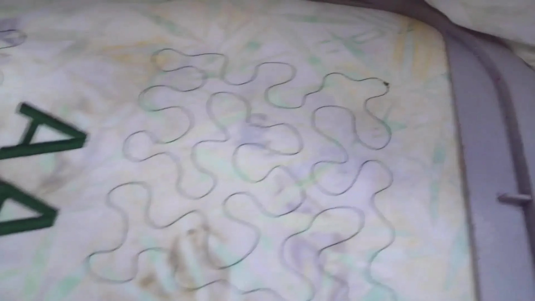 A clean stippling sample shows the “after” result of balanced quilting tension with a neat back side.
