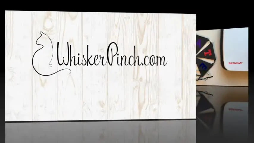 An overhead view of a finished felt bunting banner laid out on a table, showing crisp stitched edges and clean double-sided construction.