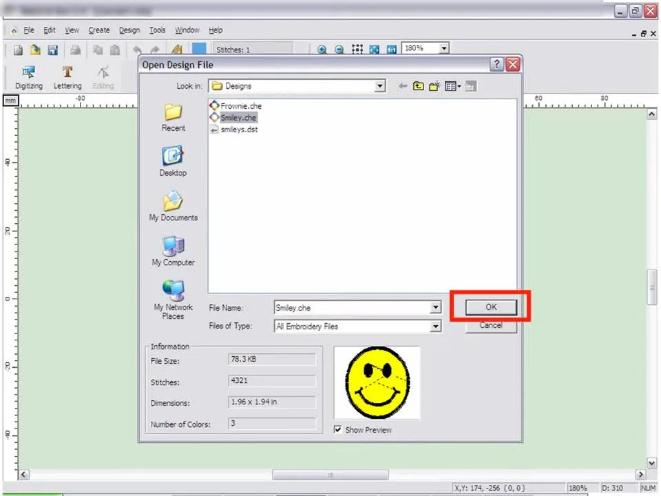 The Embroidery Studio workspace displays a loaded smiley design on a gridded background with rulers, ready for review and saving.