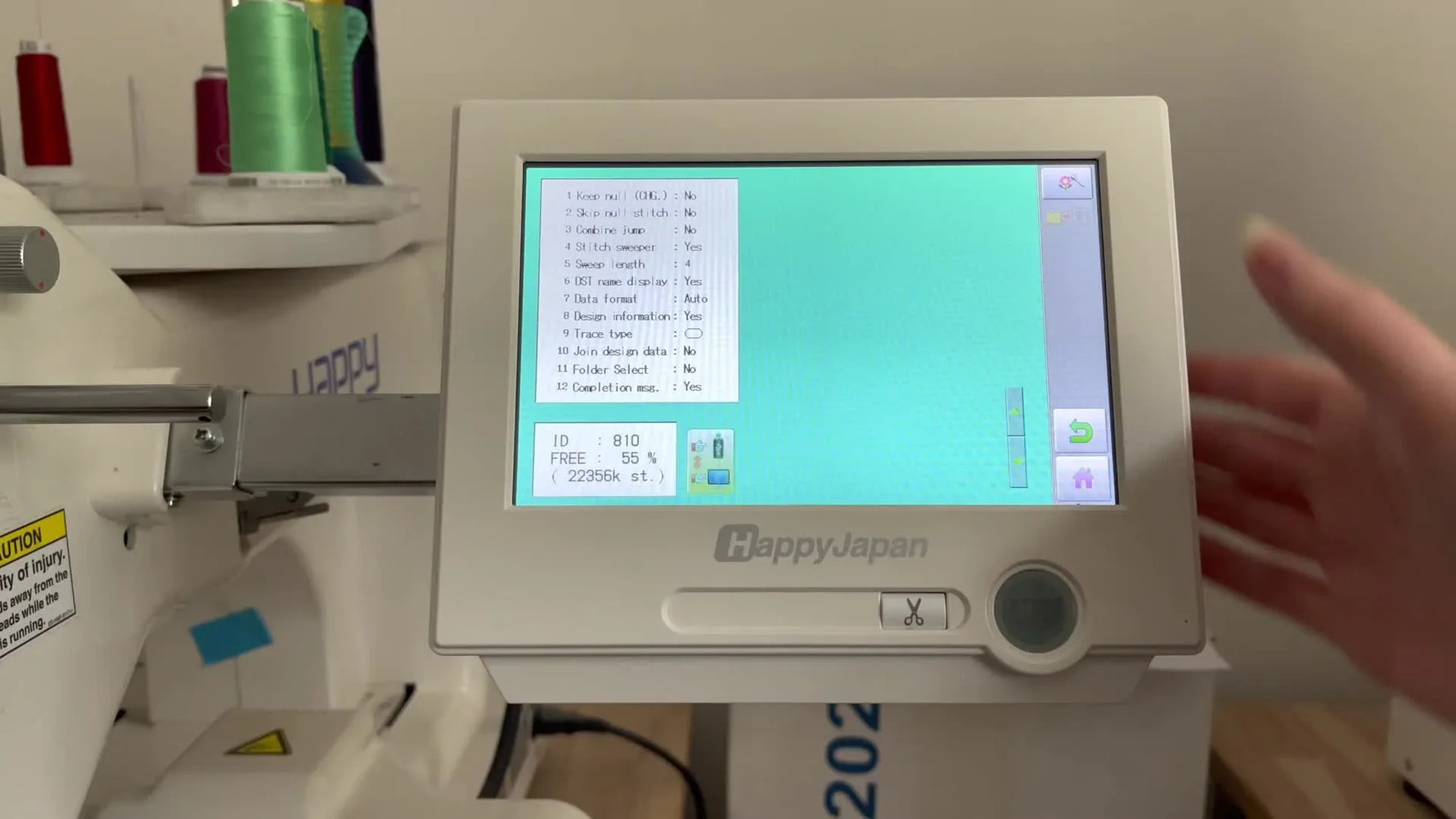 The Happy Japan HCS2 touchscreen shows a design preview with incorrect colors before needle mapping is corrected.