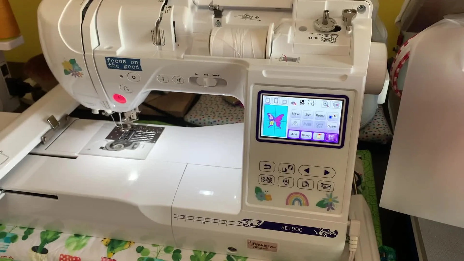 A powered-on Brother SE1900 embroidery machine ready for on-screen design editing.