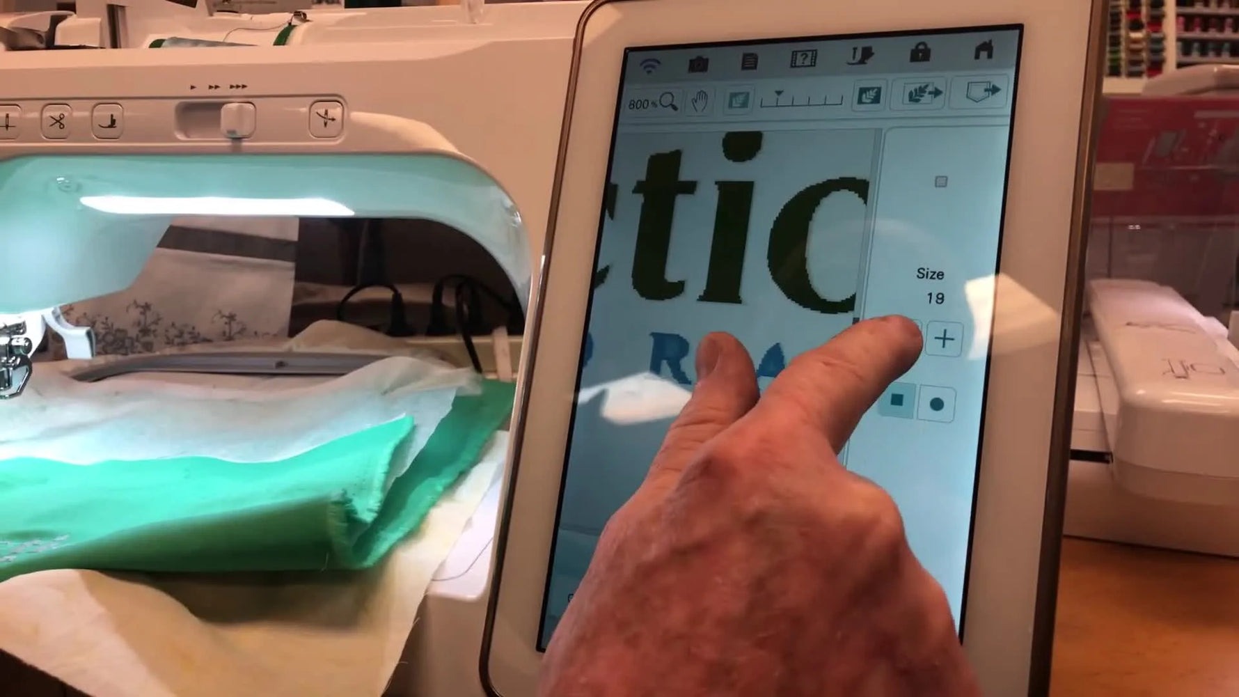 A close-up of the Baby Lock Solaris screen as the Eraser tool is used to open the blocked center of a small letter for a cleaner logo stitch-out.