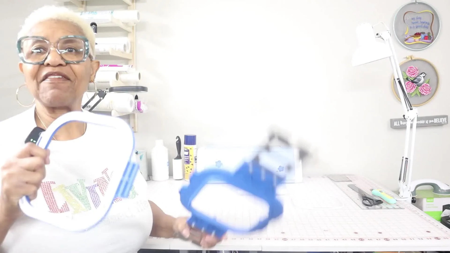 Shirley holds a 5.5-inch magnetic hoop used to stitch freestanding lace on a Brother PR1055X.