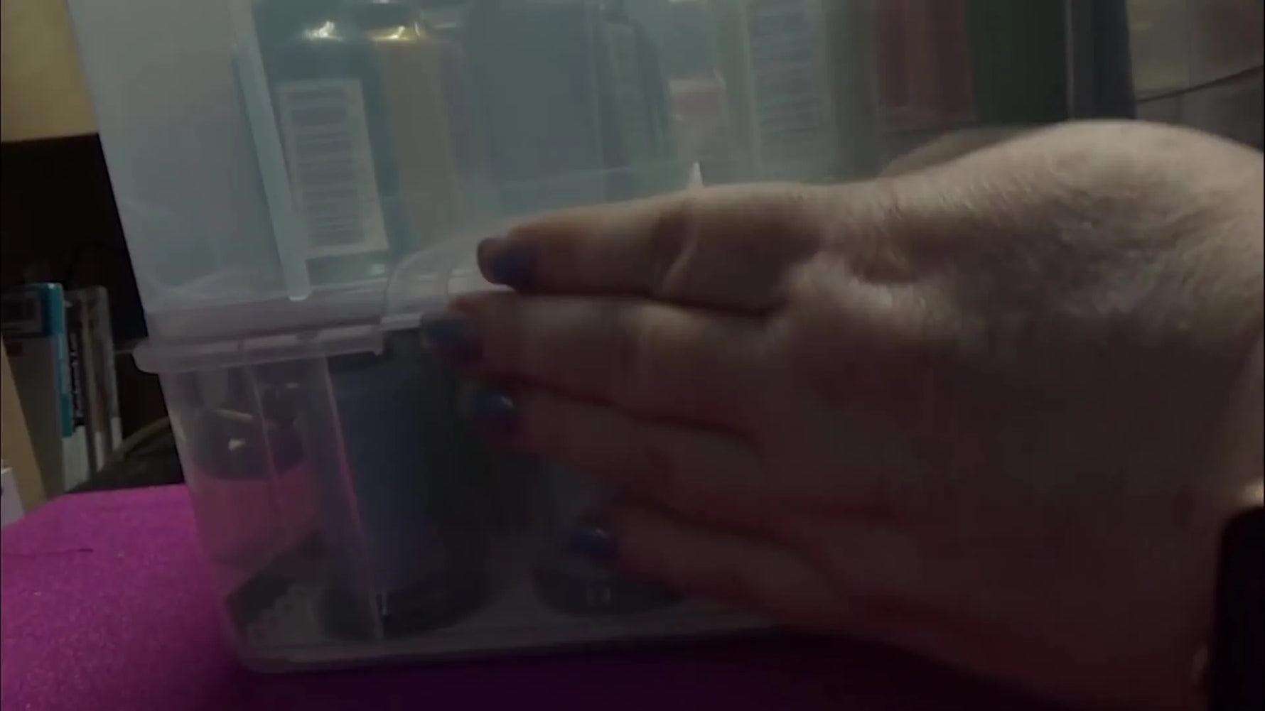 Two Stack 2 Go thread boxes are locked together and lifted by the top handle to show the stacking system is secure for transport.