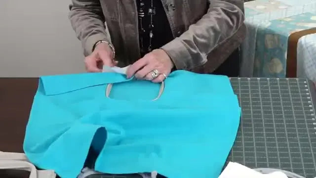 A close-up shows a screwdriver tightening an embroidery hoop screw to prevent the hoop from popping apart during stitching.