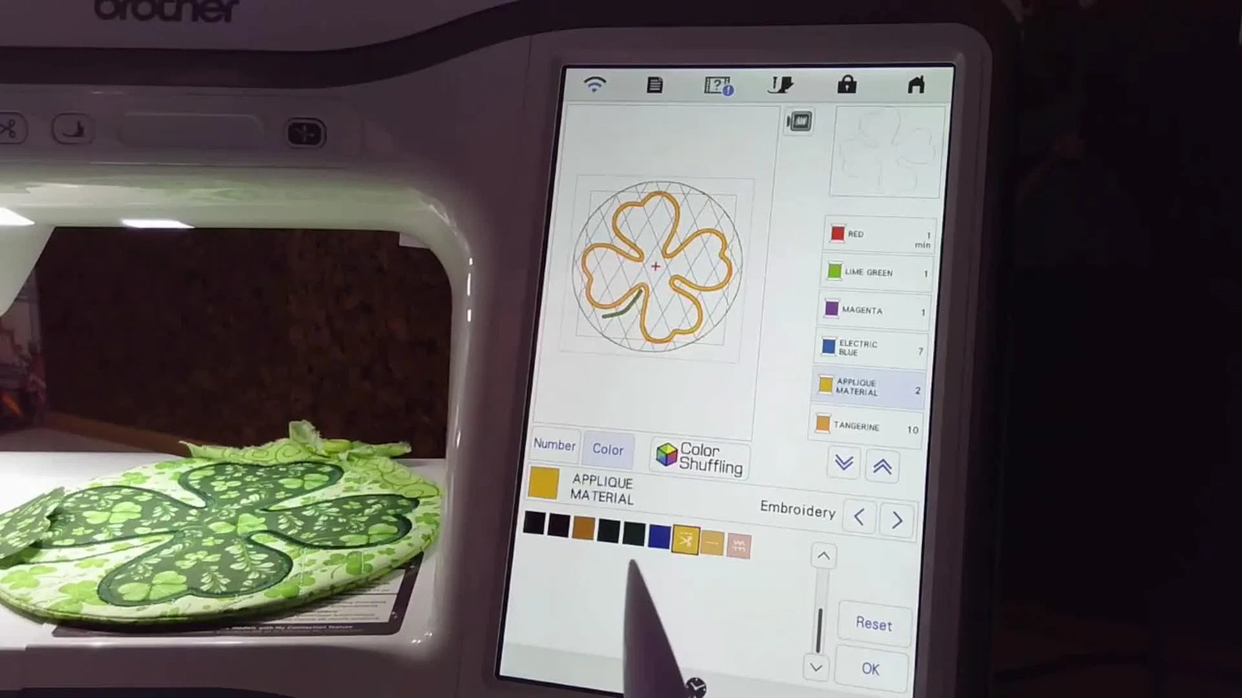 A close-up of the Brother Innov-is screen where the tack-down color layer is converted to “APPLIQUE MATERIAL” using the scissors icon.