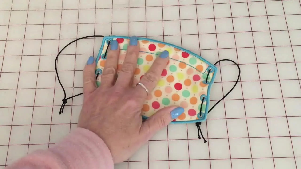 Stop Sewing, Start Stitching: An ITH Face Mask with Satin Edge, Nose Wire Channel, and Clean Eyelets