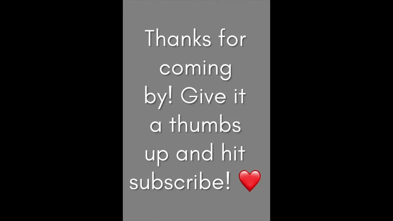 Presenter smiling in a blue Minnie Mouse t-shirt, introducing a haul vlog.