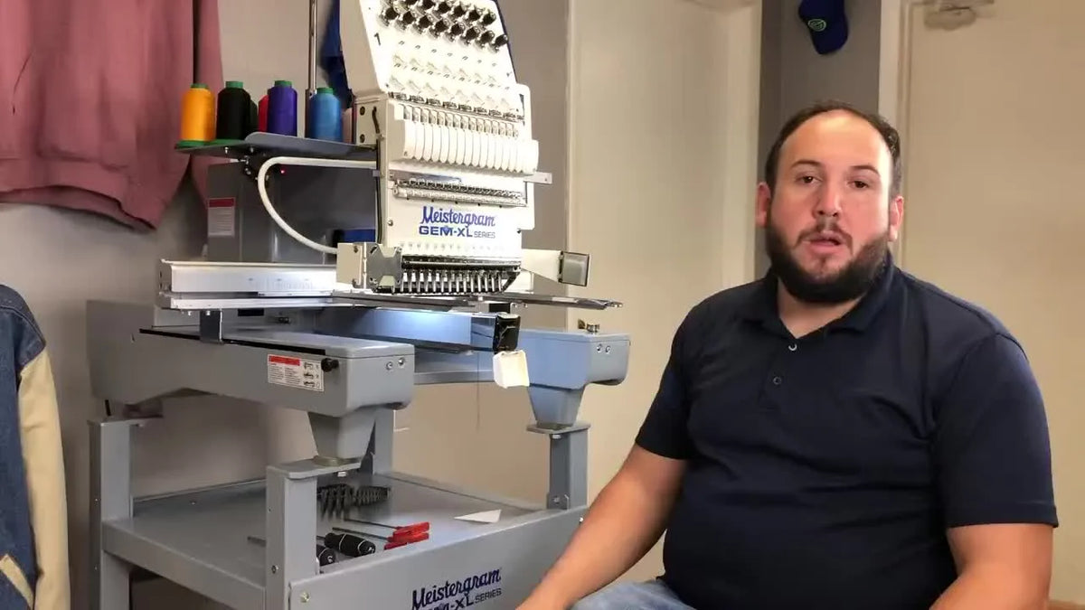 Man introducing needle bar height adjustment on embroidery machine