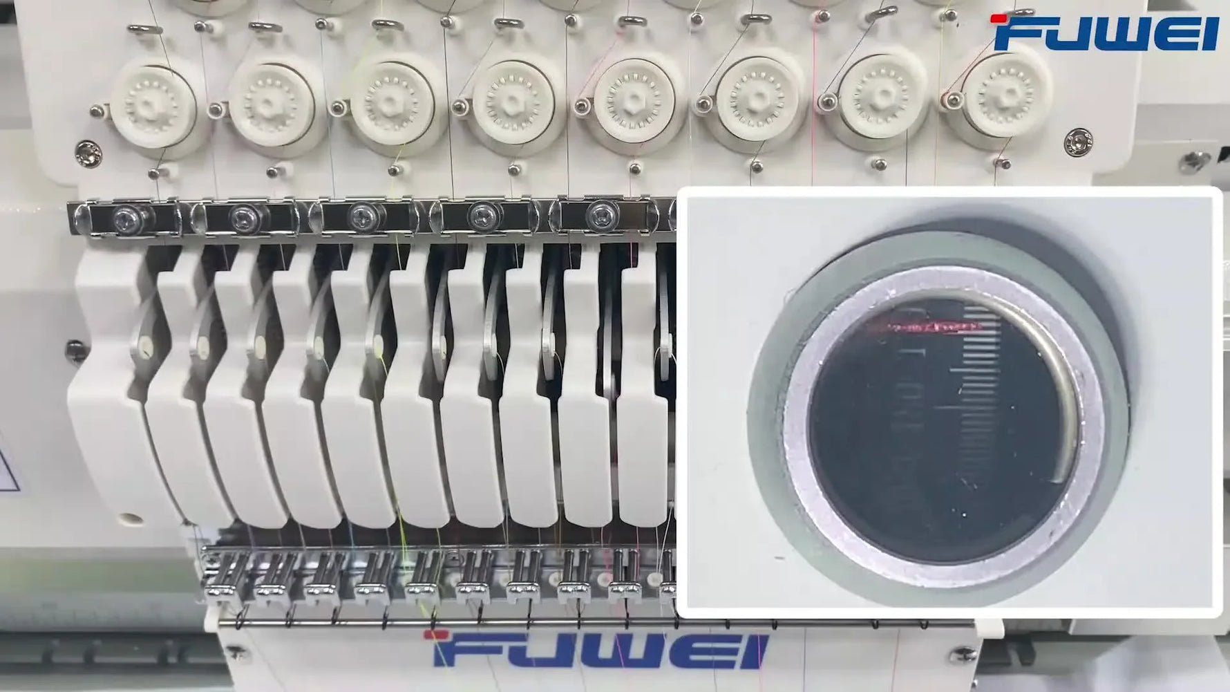 A close-up of the embroidery head’s degree wheel aligned precisely at the green 100-degree mark for timing and recovery checks.