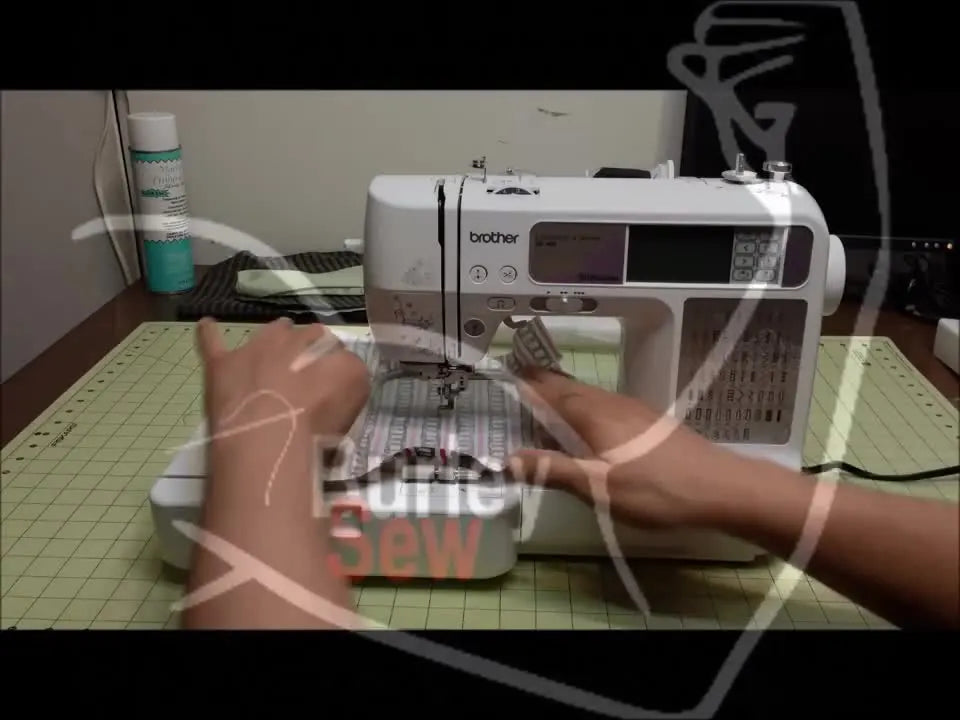 Embroidery machine with hooped fabric under the needle.