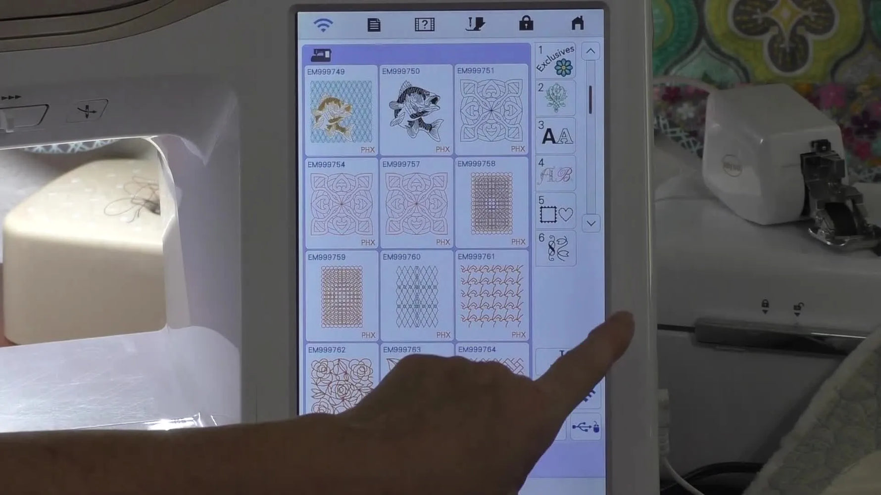 A close-up of the Baby Lock Altair stitching a continuous-line bee quilting design cleanly inside a quilt block.