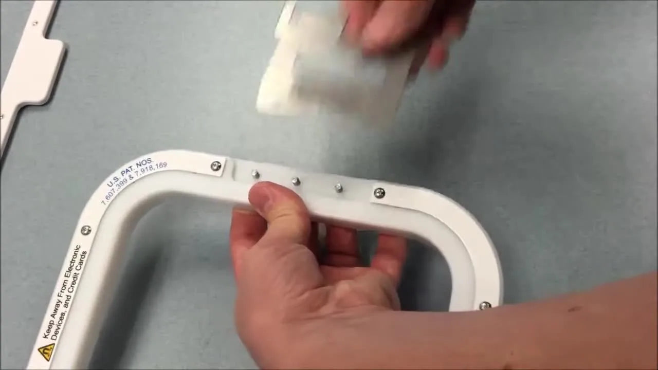 A close-up shows a Brother PR-series bracket being placed onto the protruding screws on the top of a Mighty Hoop, demonstrating correct orientation and fit.