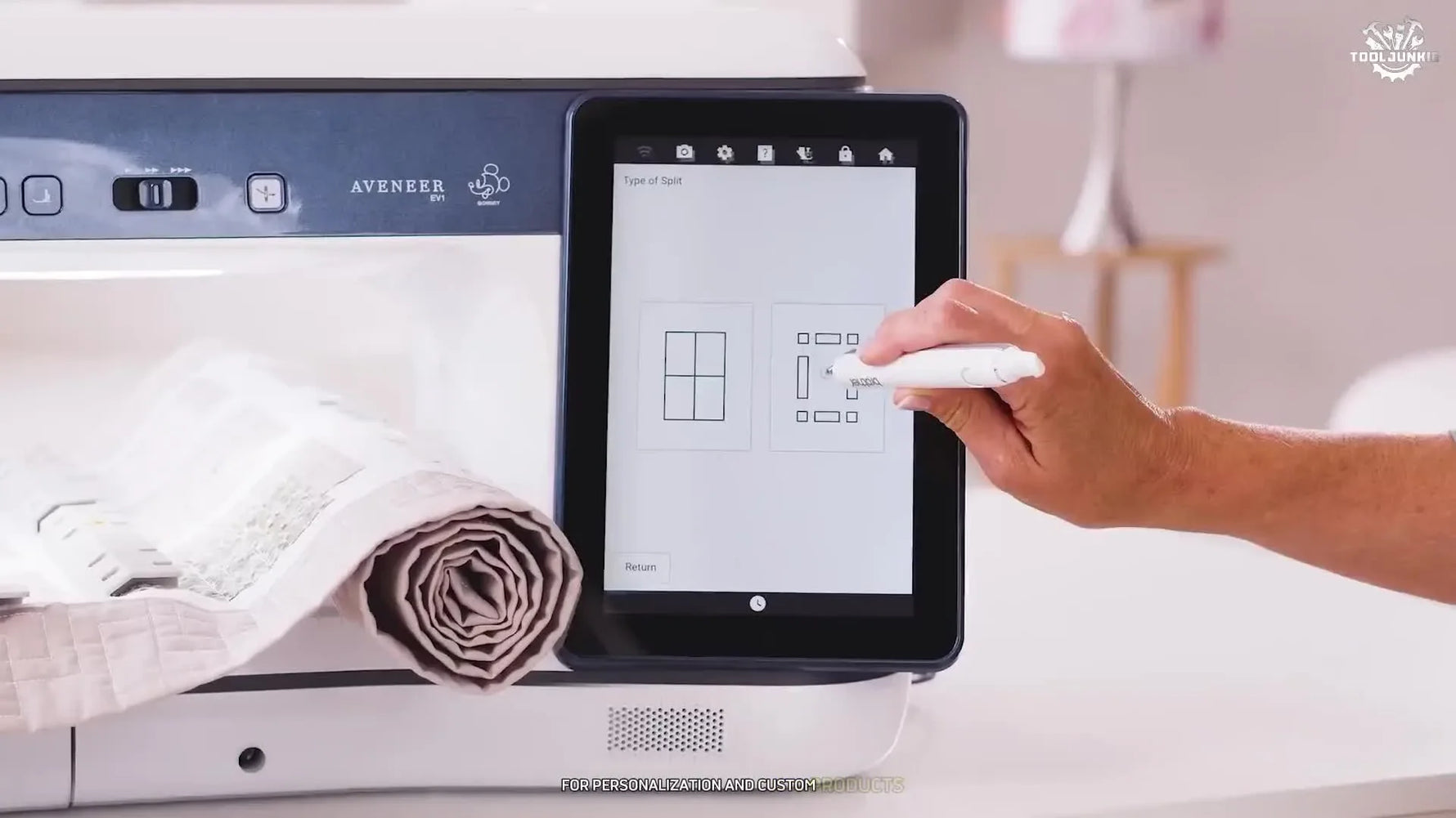 An overhead view of the Brother Aveneer EV1 projecting a grid and design onto fabric, highlighting placement accuracy and its large working field.
