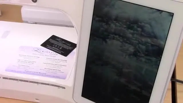 The Brother Luminaire Innov-is XP1 screen glows with the Luminaire startup logo during the first power-on.