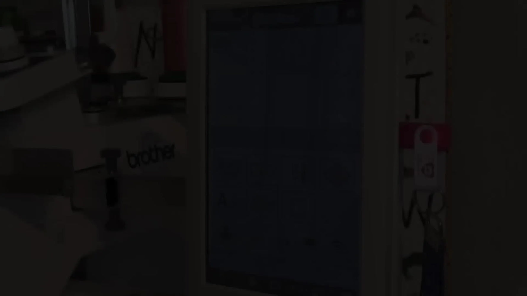 A wide view of a magnetic hoop loaded with no-show mesh stabilizer mounted on the Brother PR1055X embroidery arms, ready for camera scanning alignment.