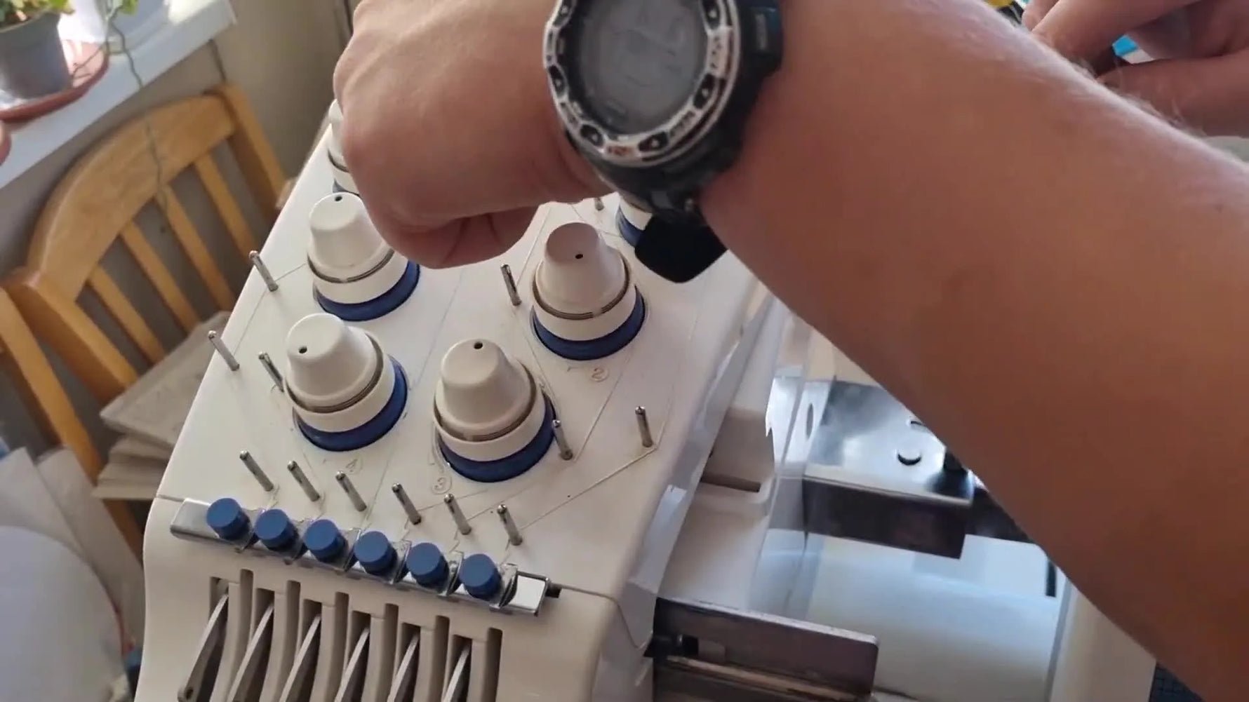 A close-up shows thread being wrapped around the Brother PR-600 tension knob for the second time, the key move that prevents false thread-break errors.