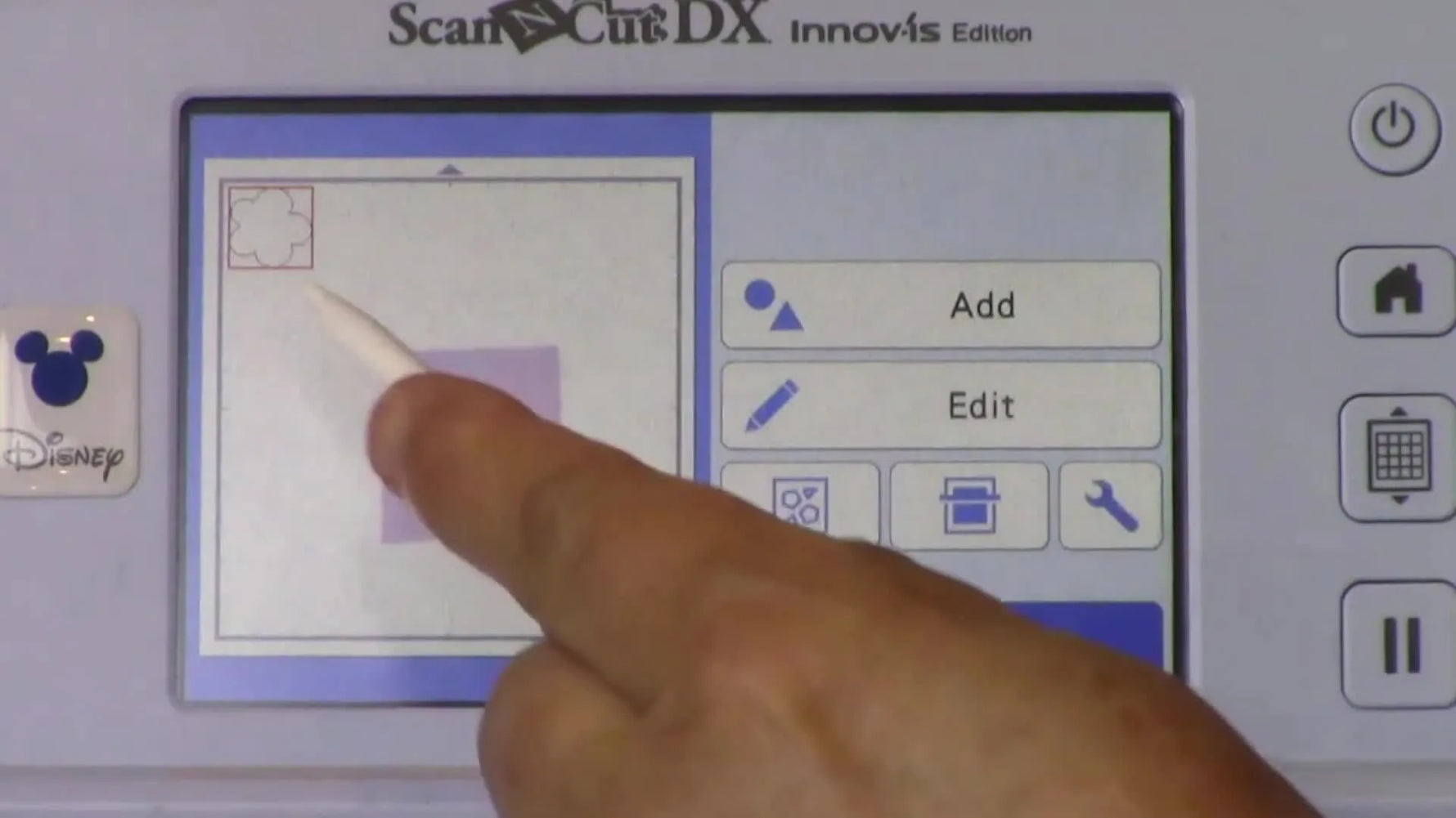 A close-up of the ScanNCut screen showing the appliqué cut line being positioned over the scanned fabric for precise cutting.