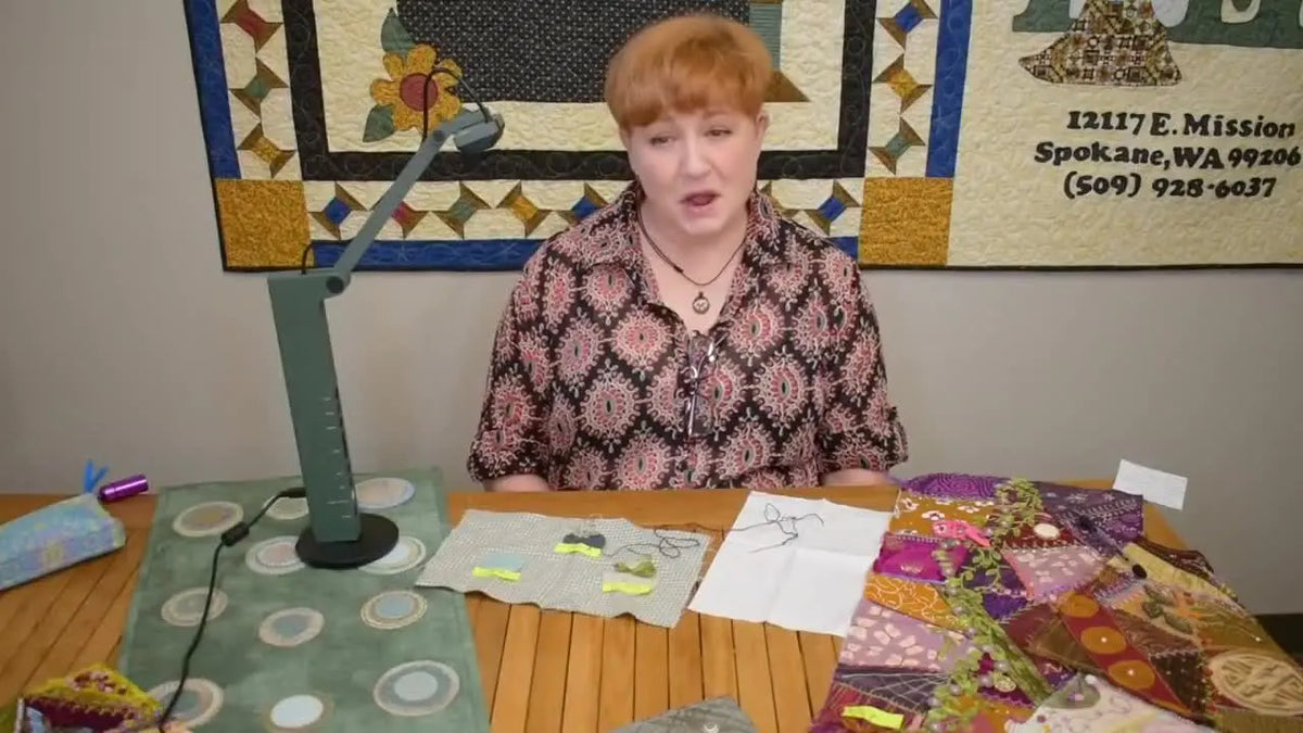 Rebecca introduces herself at The Quilting Bee studio with fabrics and tools.