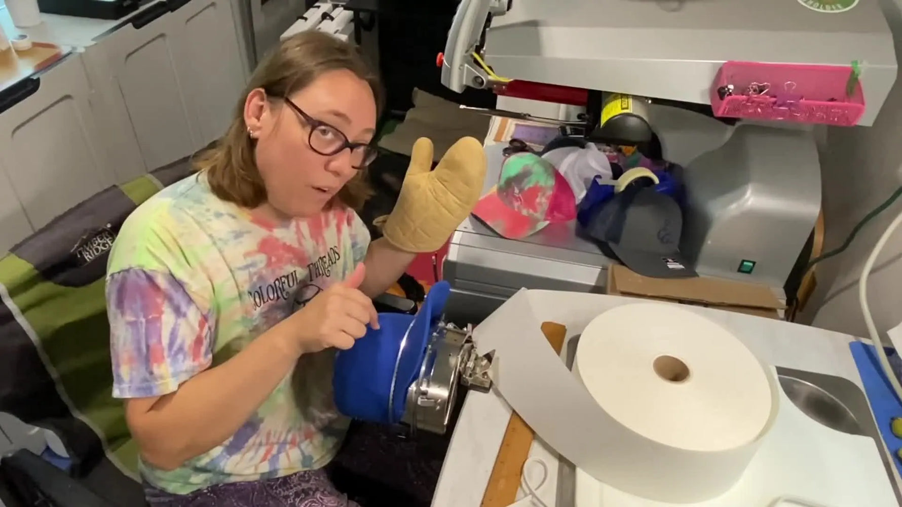 A perfectly hooped blue hat, stable and flat against the hoop, ready for embroidery.