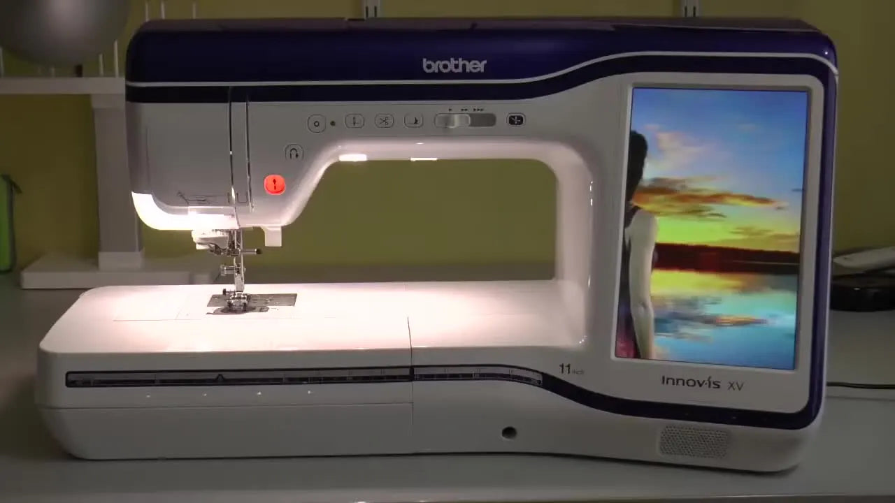 The Brother Innov-is XV touchscreen shows the colorful boot animation during the machine’s first power-on.