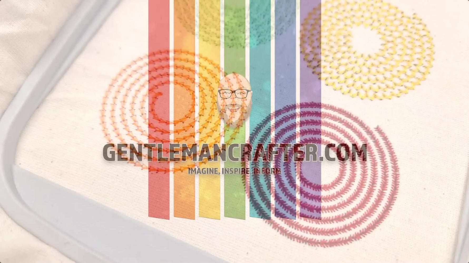 Stitched out embroidery samples of colorful spirals on fabric in a hoop.