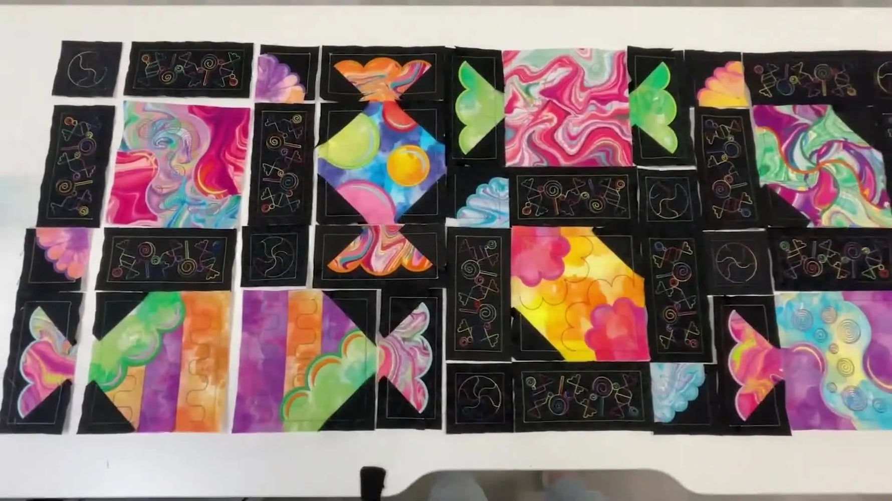 An overhead layout of the completed Confection Perfection runner blocks arranged before final assembly, showing the full patchwork candy design.