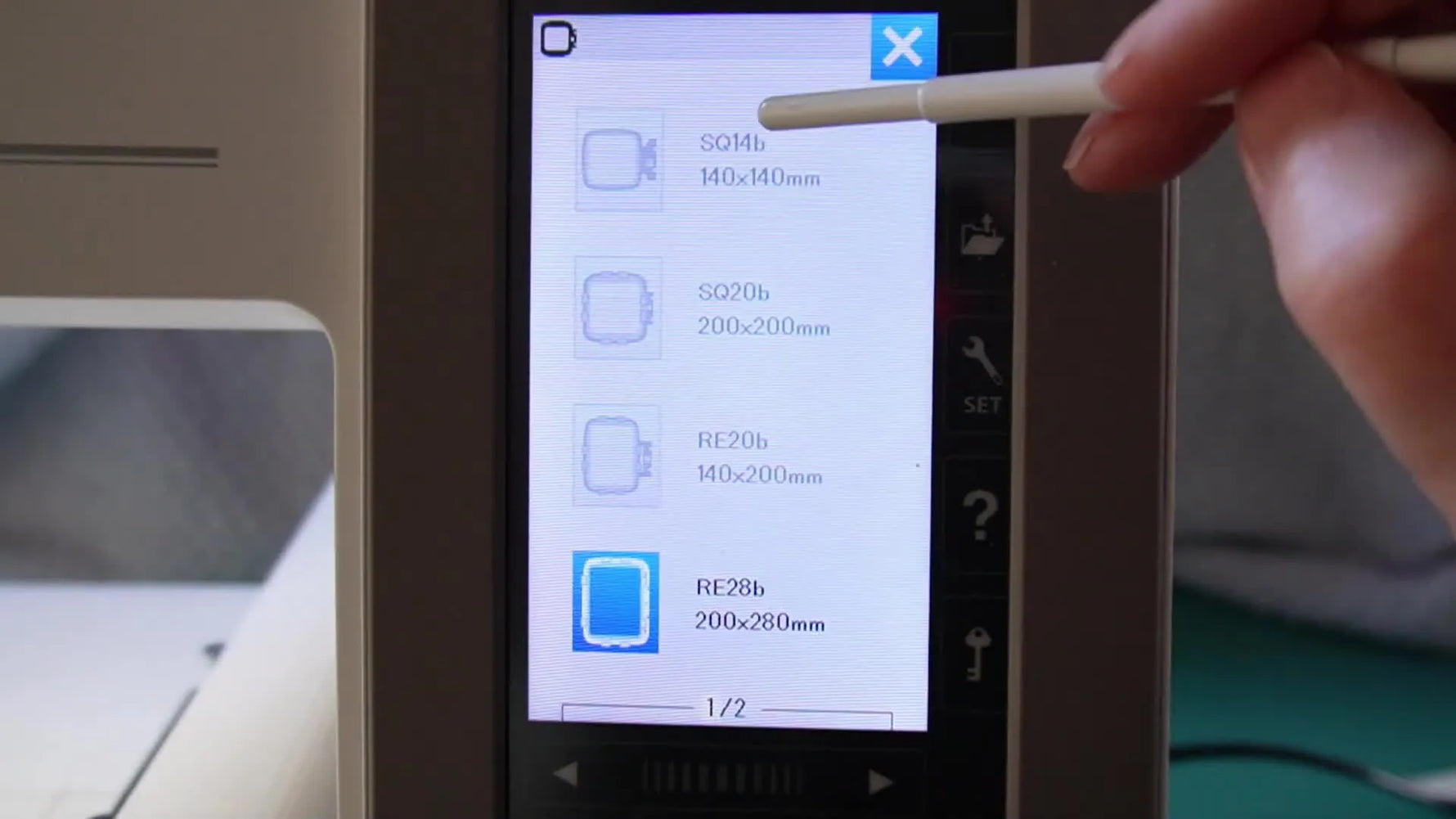 The Janome Edit screen shows the Group function selecting multiple text objects so the layout can be centered and re-fit into a smaller hoop.