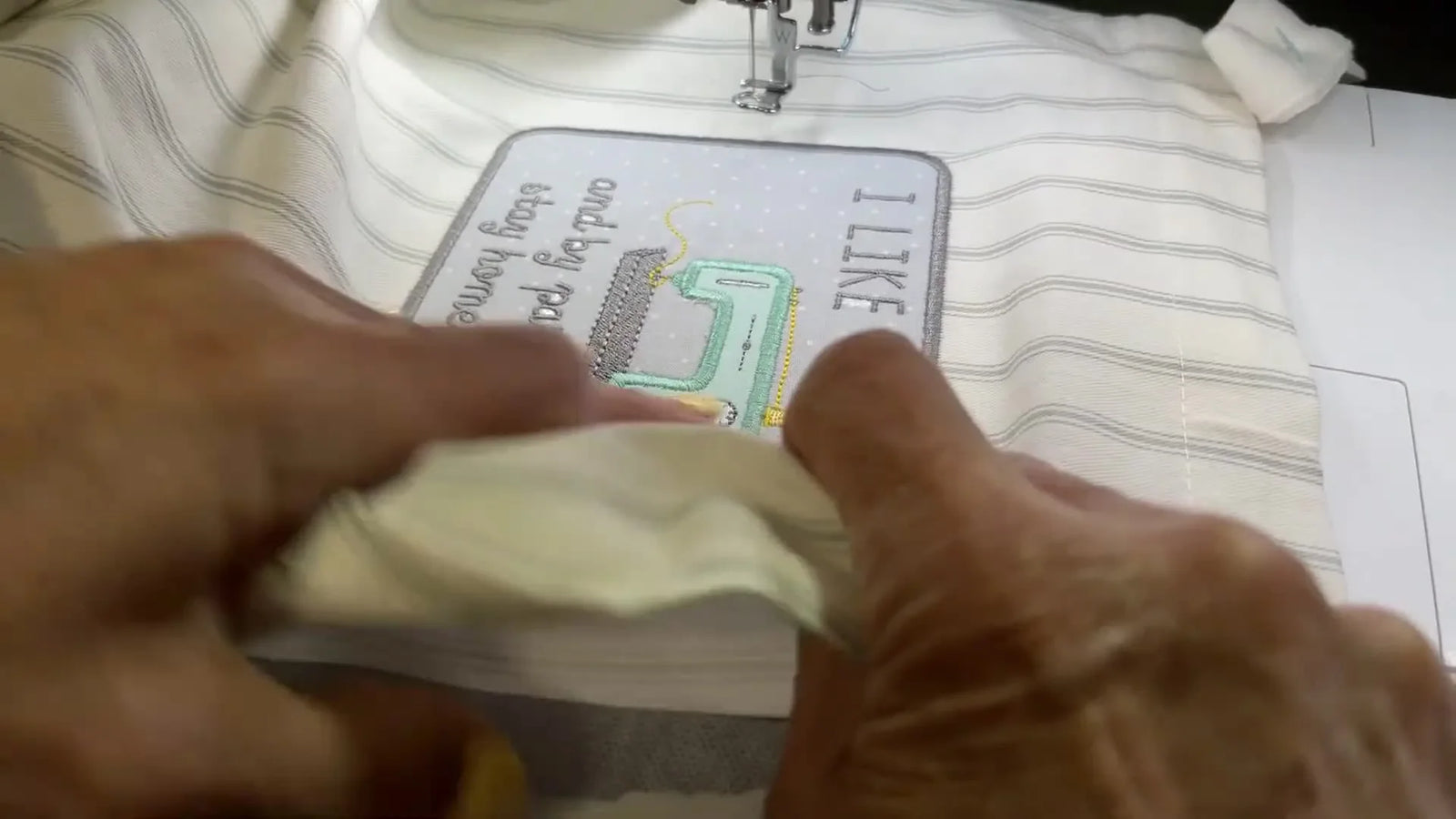 A Clean, No-Panic Way to Embroider an Apron: Sticky Stabilizer Crosshairs, Crisp Lettering, and Appliqué That Doesn’t Fray